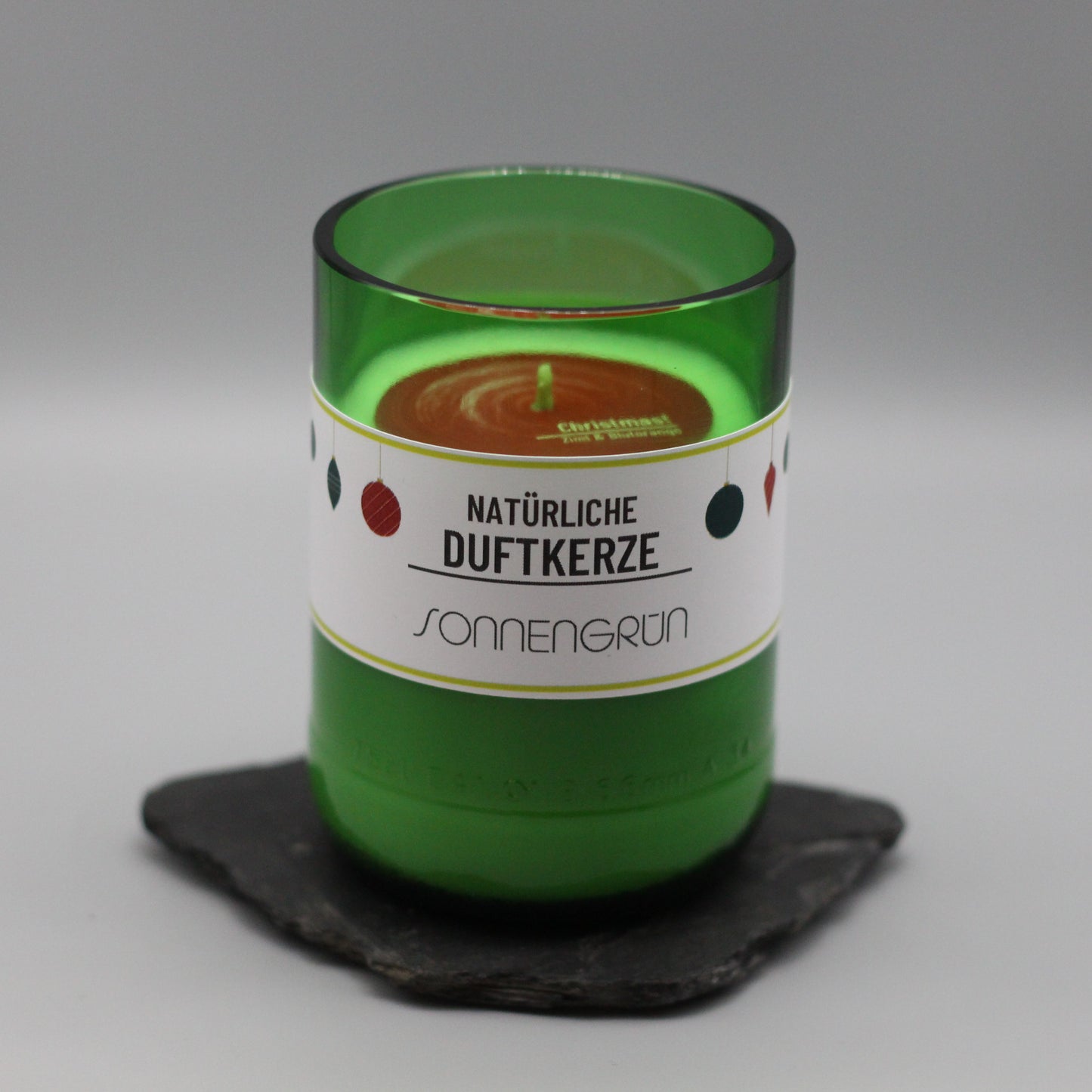 duftende Weihnachtskerze mit Zimt und Blutorange