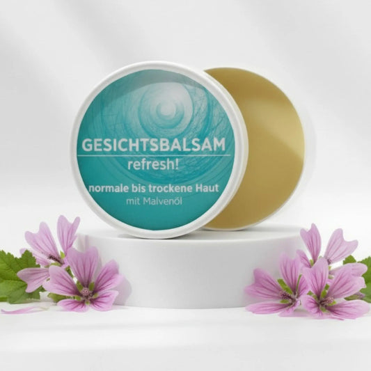 Gesichtsbalsam mit natürlichen Inhaltsstoffen bei trockener Haut mit Malvenöl, Gesichtsbalsam ist in weißem, zylindrischem Karton verpackt mit türkisem Etikett.