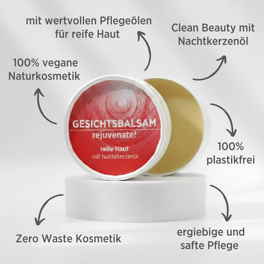 Gesichtsbalsam mit natürlichen Inhaltsstoffen für reife Haut mit Nachtkerzenöl, Gesichtsbalsam ist in weißem, zylindrischem Karton verpackt mit rotem Etikett, zudem sind detaillierte Produktinformationen am Bild zu lesen.
