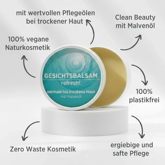 Gesichtsbalsam mit natürlichen Inhaltsstoffen bei trockener Haut mit Malvenöl, Gesichtsbalsam ist in weißem, zylindrischem Karton verpackt mit türkisem Etikett, zudem sind detaillierte Produktinformationen am Bild zu lesen.