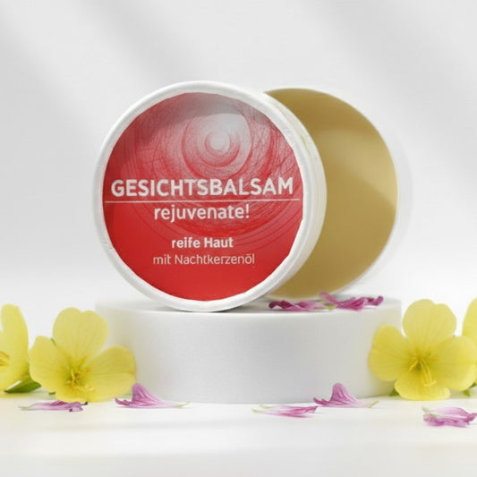 Gesichtsbalsam mit natürlichen Inhaltsstoffen für reife Haut mit Nachtkerzenöl, Gesichtsbalsam ist in weißem, zylindrischem Karton verpackt mit rotem Etikett.
