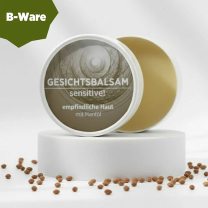 Gesichtsbalsam mit natürlichen Inhaltsstoffen für empfindliche Haut ohne Duftstoffe, Gesichtsbalsam ist in weißem, zylindrischem Karton verpackt mit beigem Etikett. B-Ware, Verpackung beschädigt.