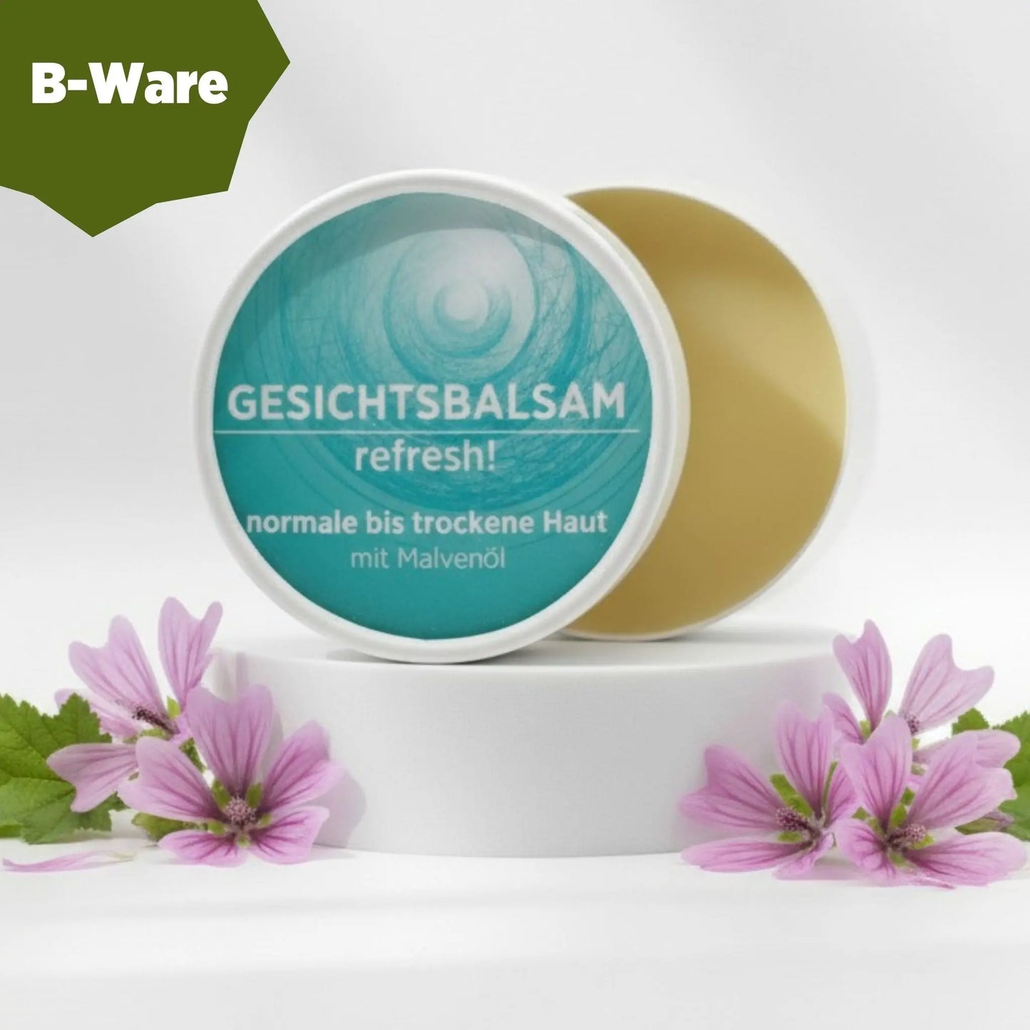 Gesichtsbalsam mit natürlichen Inhaltsstoffen bei trockener Haut mit Malvenöl, Gesichtsbalsam ist in weißem, zylindrischem Karton verpackt mit türkisem Etikett. B-Ware - Inhalt in Ordnung, Verpackung leicht beschädigt.