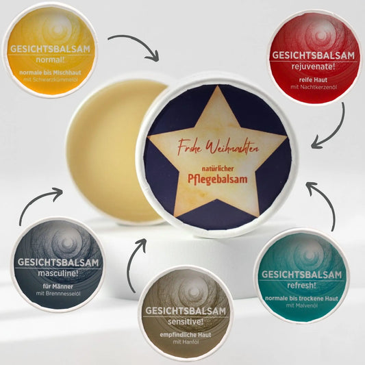 Auf dem Bild sieht man den Pflegebalsam mit einem Etikett, gestaltet speziell für Weihnachten. Rund um den Tiegel sind die diversen Sorten der Gesichtsbalsame mit Pfeil auf den Tiegel, was symbolisiert, dass die Gesichtsbalsame mit dem Etikett personalisiert werden können.