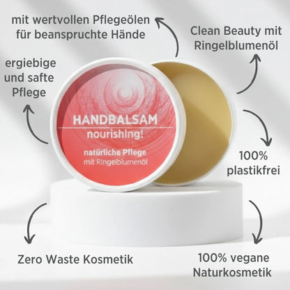 Handbalsam mit natürlichen Inhaltsstoffen für trockene Hände mit Ringelblume, Balsam ist in weißem, zylindrischem Karton verpackt mit rotem Etikett, zudem sind detaillierte Produktinformationen am Bild zu lesen.